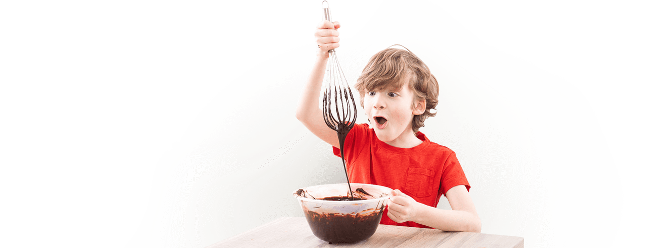 Kid mixing chocolate in a bowl
